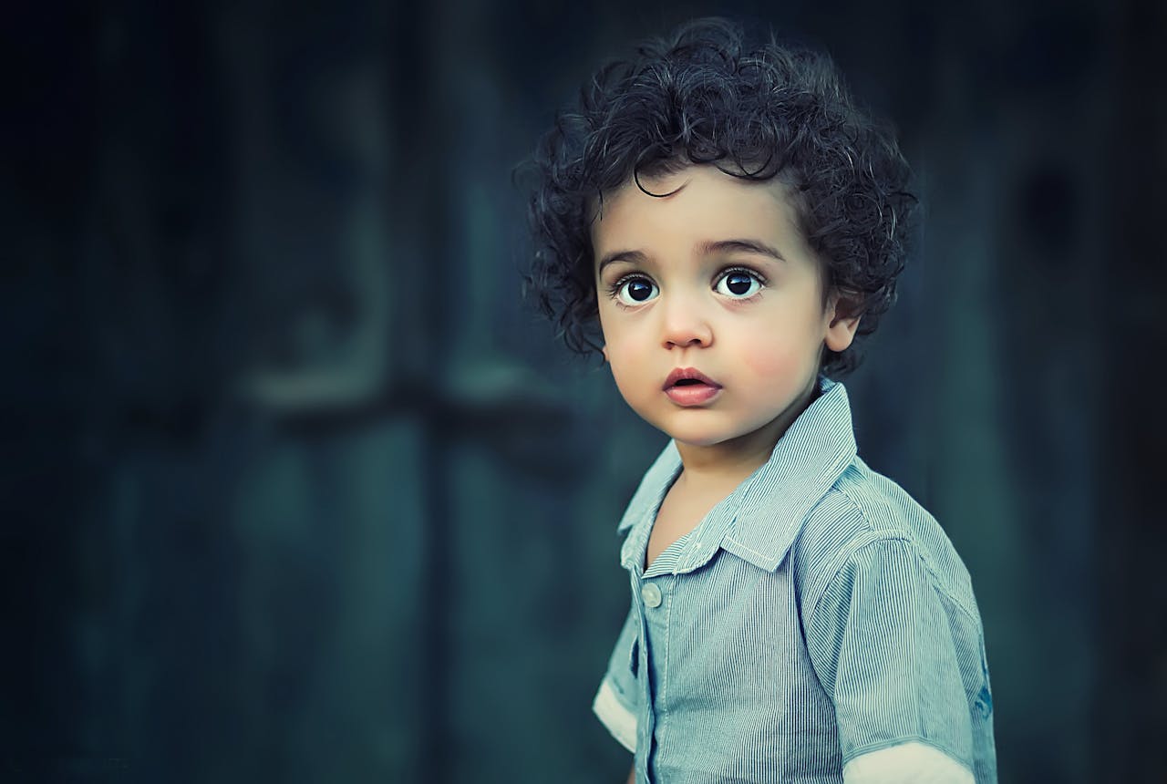 Toddle Wearing Gray Button Collared Shirt With Curly Hair